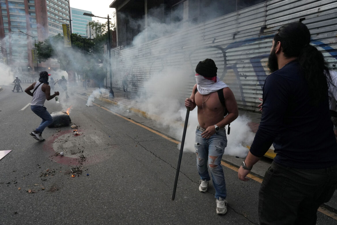 Supporters of the Venezuelan opposition demonstrate following the announcement that Venezuela’s President Maduro won the presidential election, in Caracas